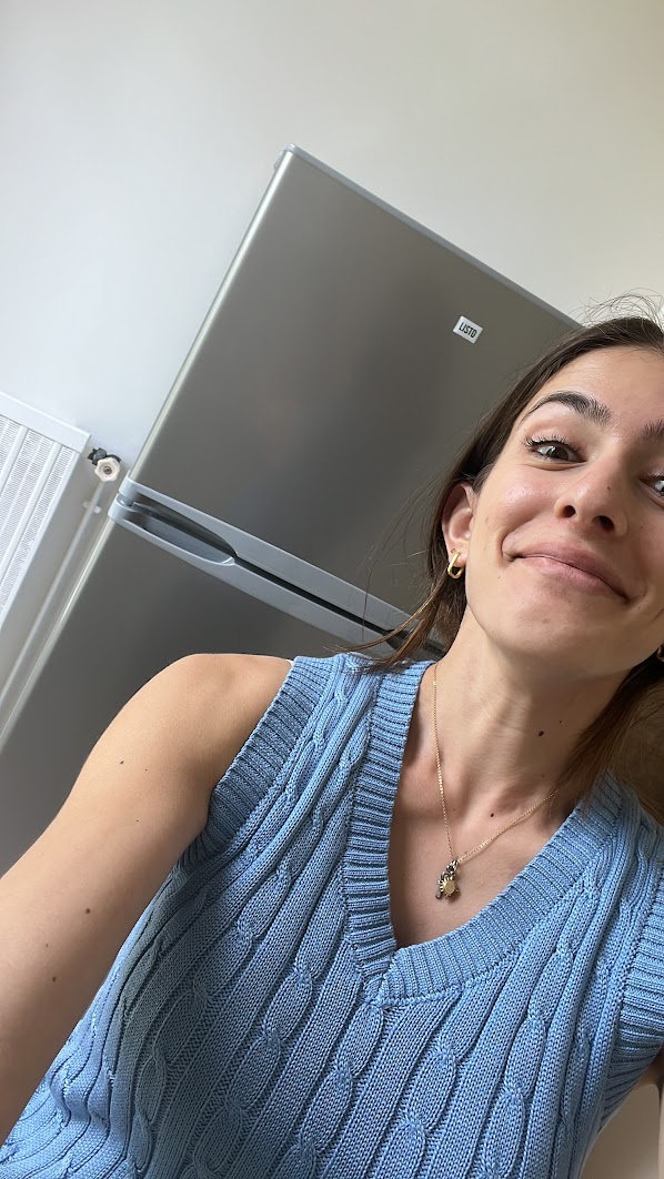 Stephanie in front of new fridge